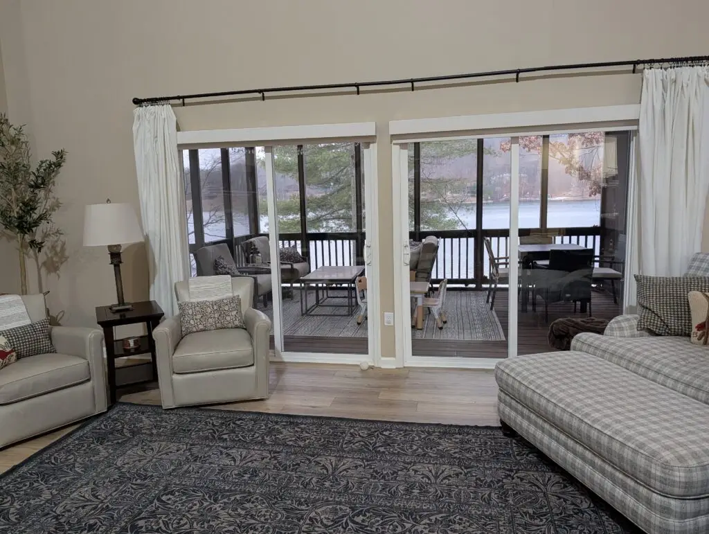 Living room with new flooring and sliding doors to the porch